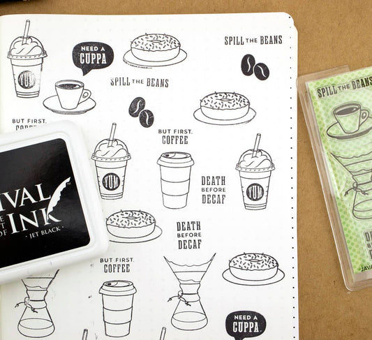 Clear stamp set with black coffee icons on white backing, shown in storage case.