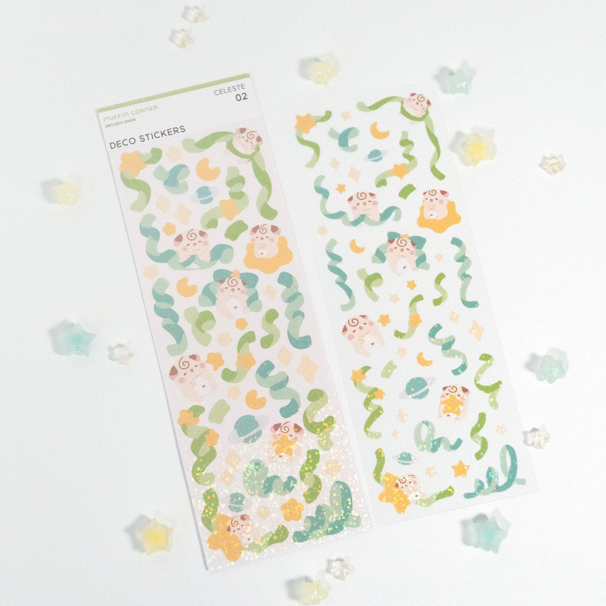 Decor sticker sheet with green leaf shapes, orange accents, and cat faces
