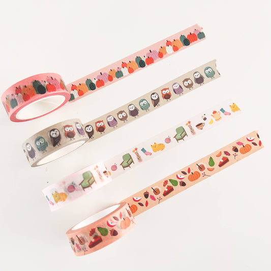 Set of four washi tape rolls with different animal, food, and plant patterns