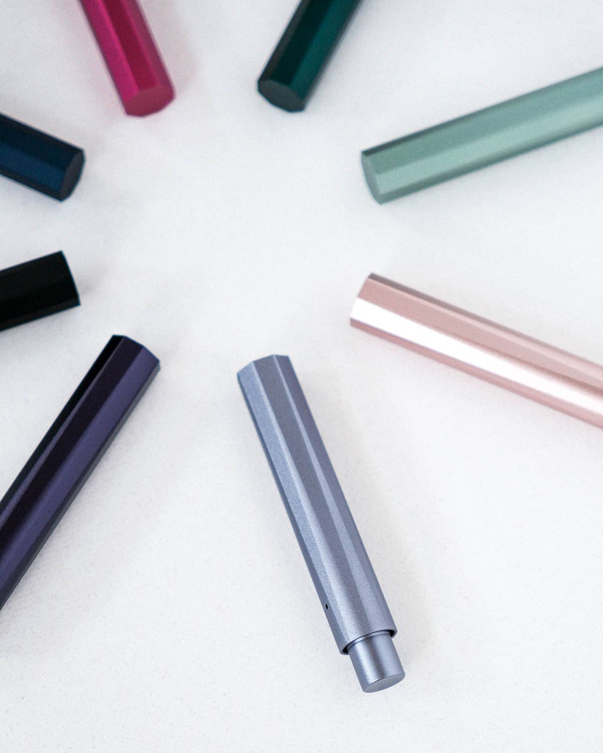 Refillable writing pen, silvery barrel with nib tip and darker end cap