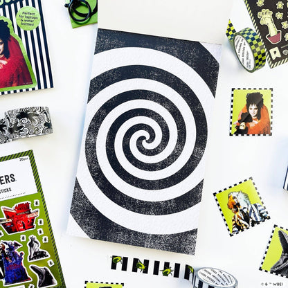 Black and white spiral target sticker sheet on white backing