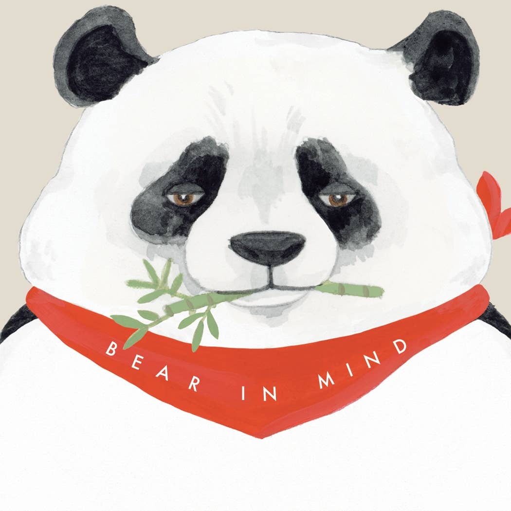 Panda bear notepad close-up showing white face and red “BEAR IN MIND” band
