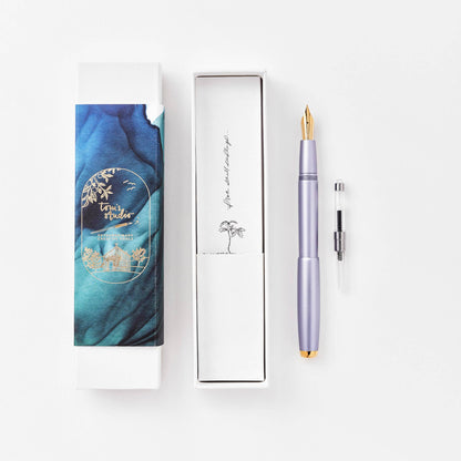 Lilac fountain pen in gift box with spare nib cartridge.