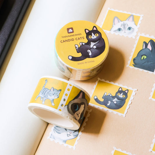Washi tape roll with candid cats stamp pattern, yellow and blue designs