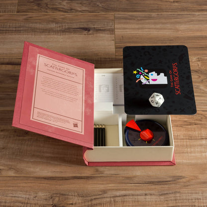 Open vintage board game box with rule booklet, card insert, and dice tray