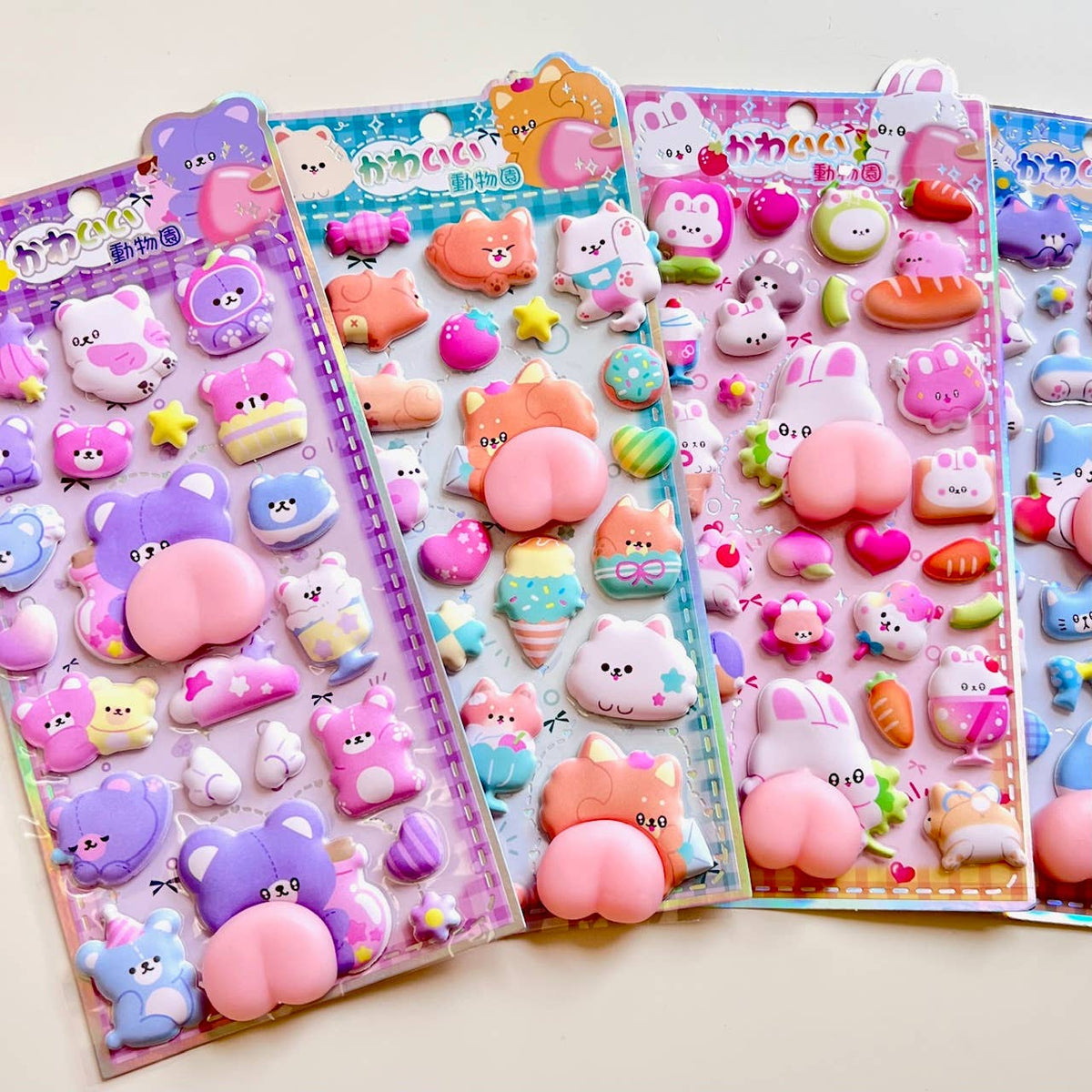 Animal squishy butt sticker set on card with pastel cats, rabbits, stars, and eggs