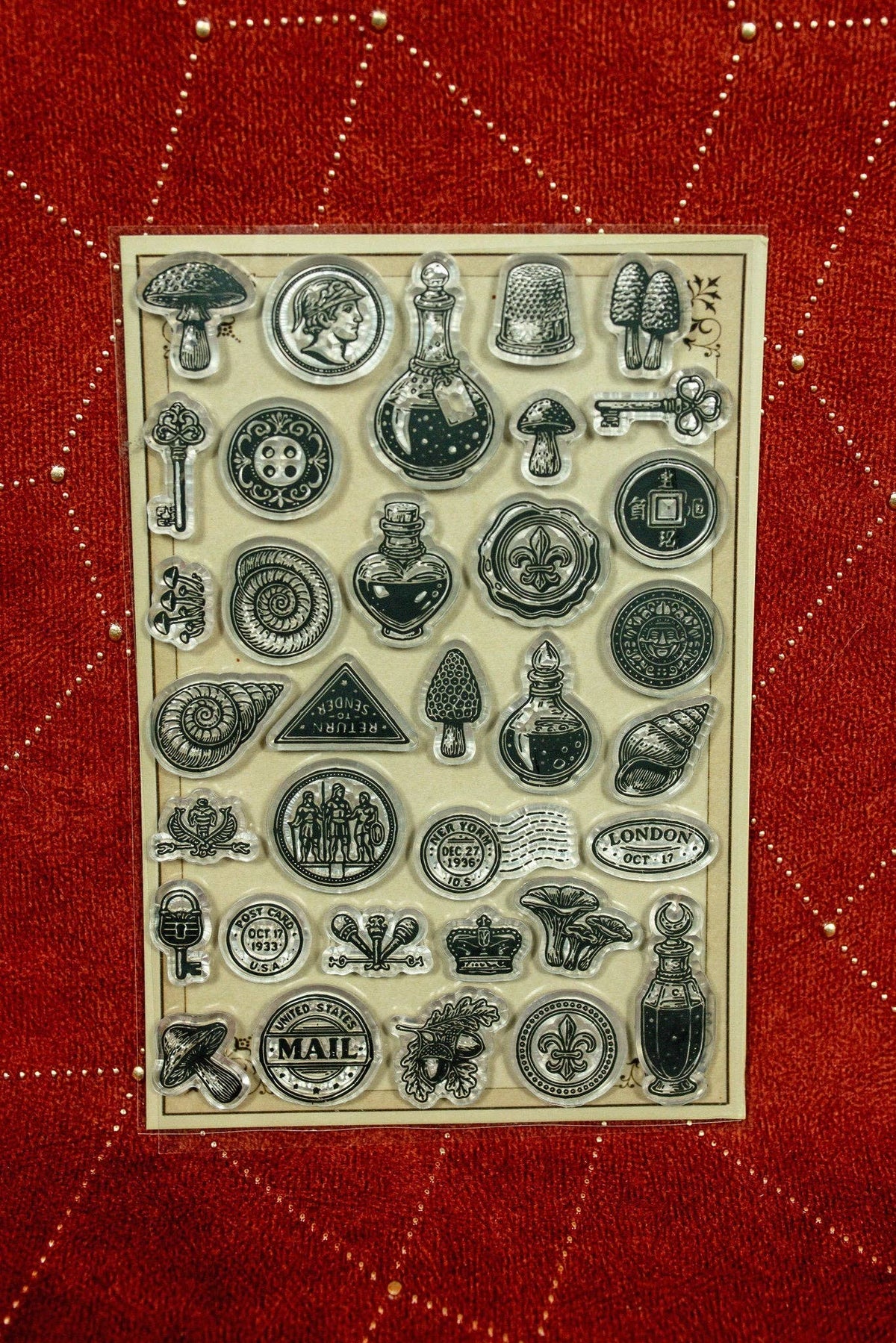 Clear acrylic stamp set with assorted vintage travel and mail symbols, clocks, letters, bottles