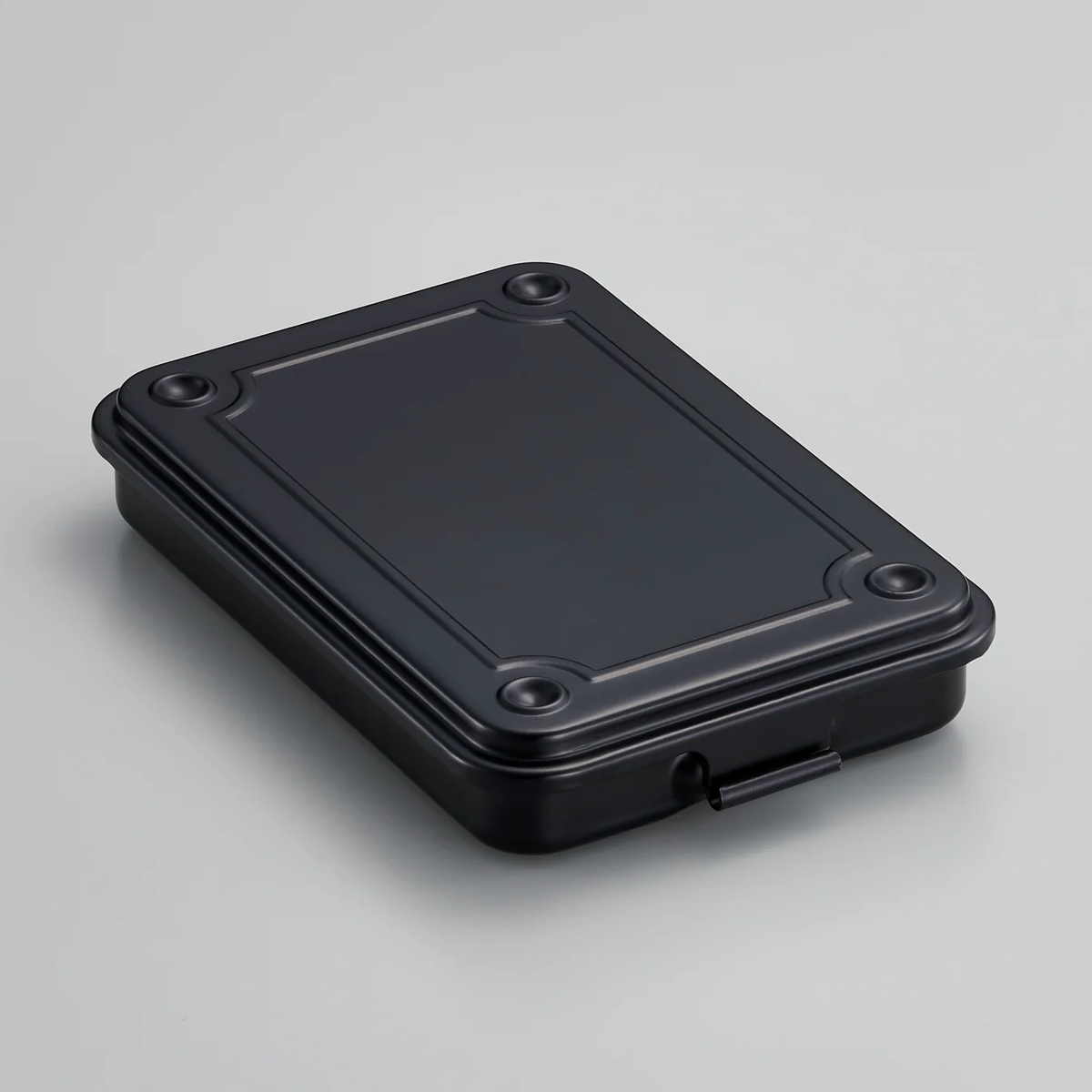 Toyo steel stackable storage box in black, with a raised lid and front latch