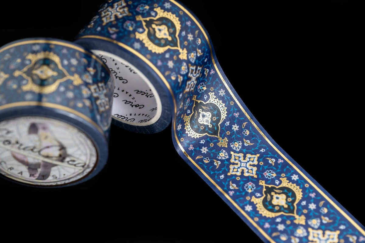 Blue foil washi tape with gold medallion pattern, close-up of rolls and strip