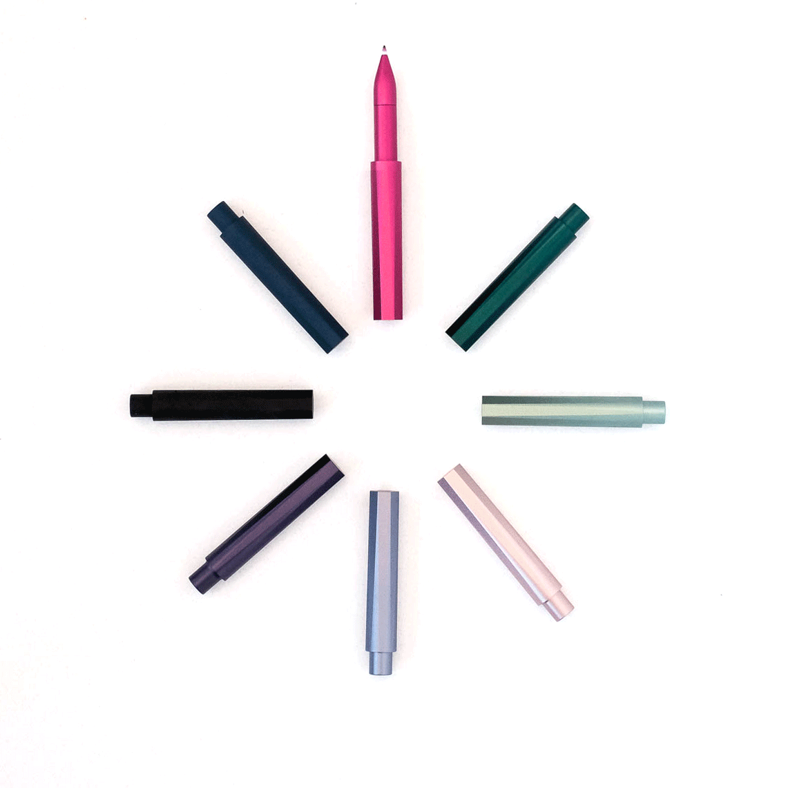 Refillable writing pen assortment, pink, teal, black, and silver barrels