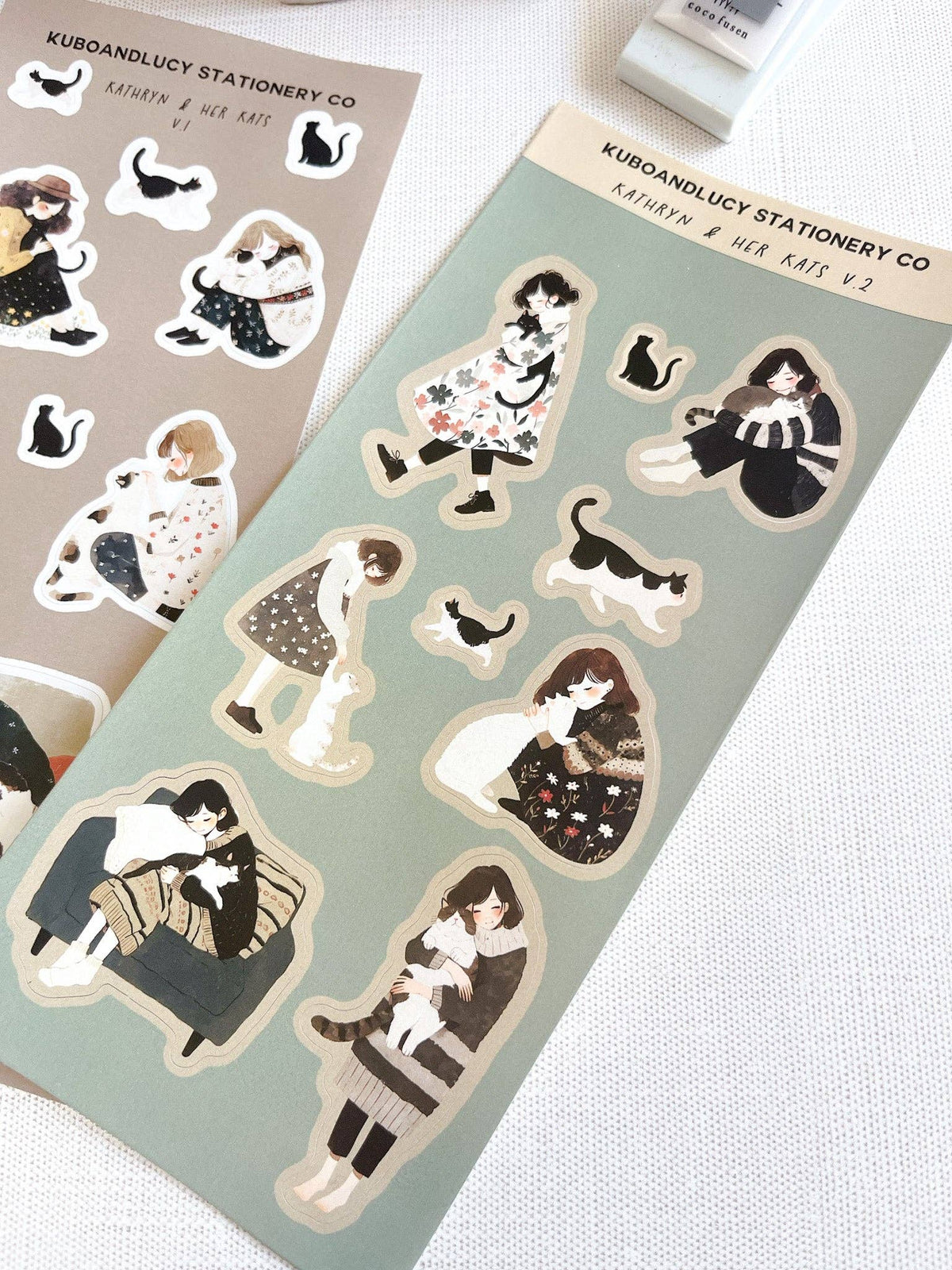 Mint cat-themed sticker sheet with illustrated female and pet characters and paw icons