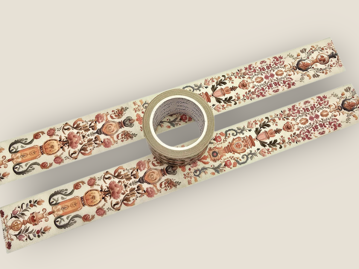 Tapestry washi tape with ornate floral and vine pattern, roll shown in center