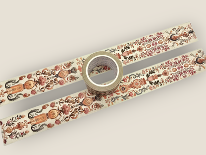 Tapestry washi tape with ornate floral and vine pattern, roll shown in center
