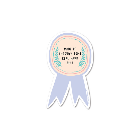 Matte vinyl sticker, round seal with ribbon tails and laurel wreath, pastel blue border.