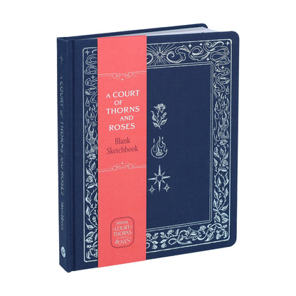 Navy blank sketchbook with ornate white border, coral spine panel