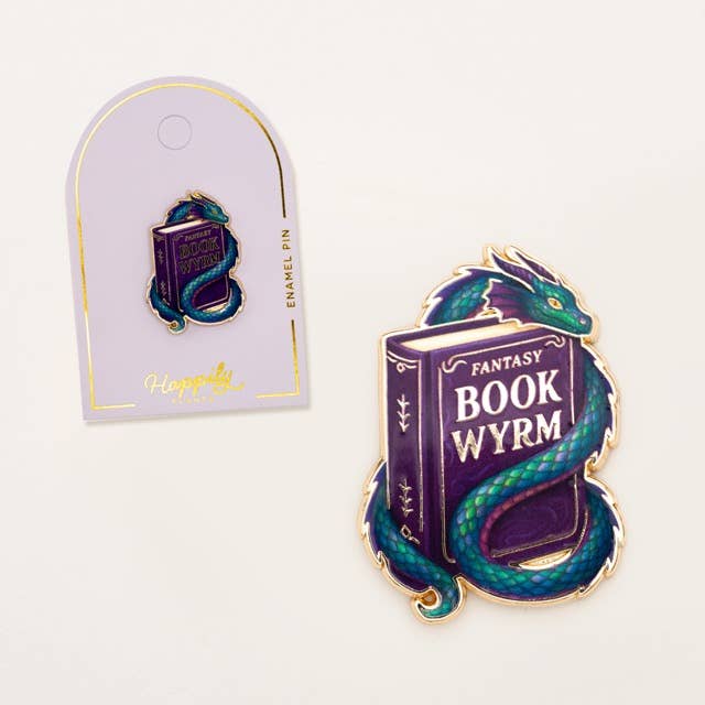 Book Wyrm dragon enamel pin on backing card, purple book with teal-blue scales