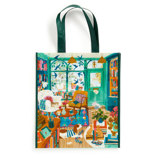 Reusable shopping tote bag with teal handles and colorful bookstore-style print