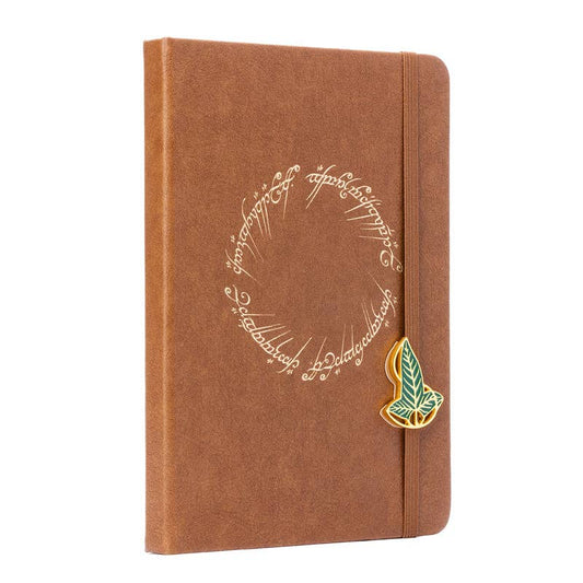 Brown journal with leaf charm on front cover and oval rune-style design