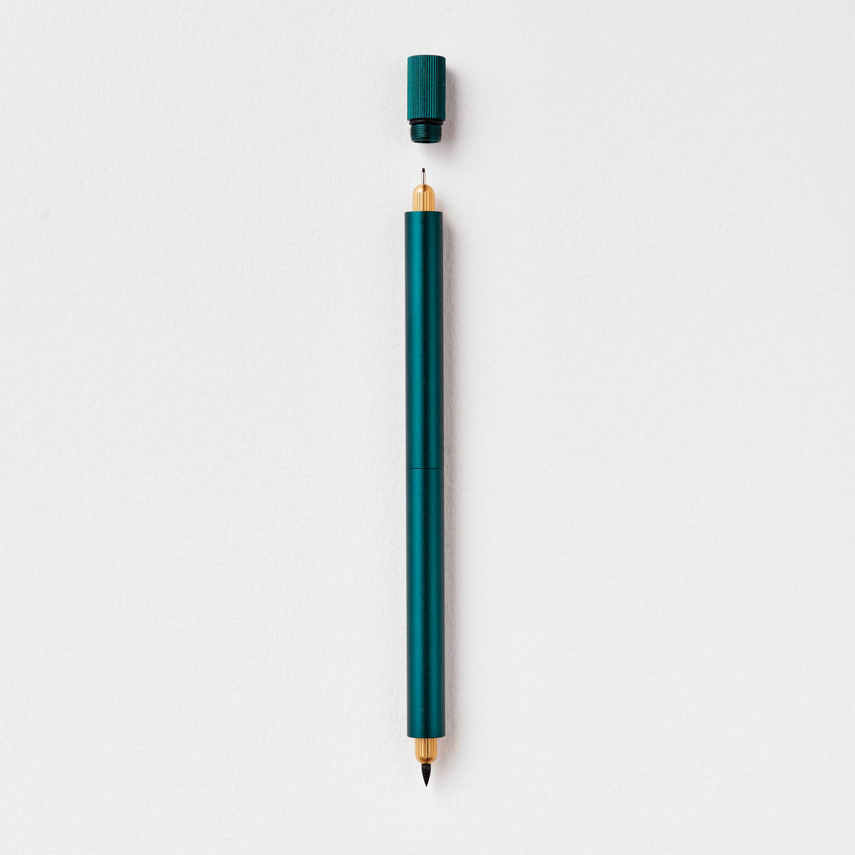Teal refillable multi-tip pen with capped top and gold writing tip