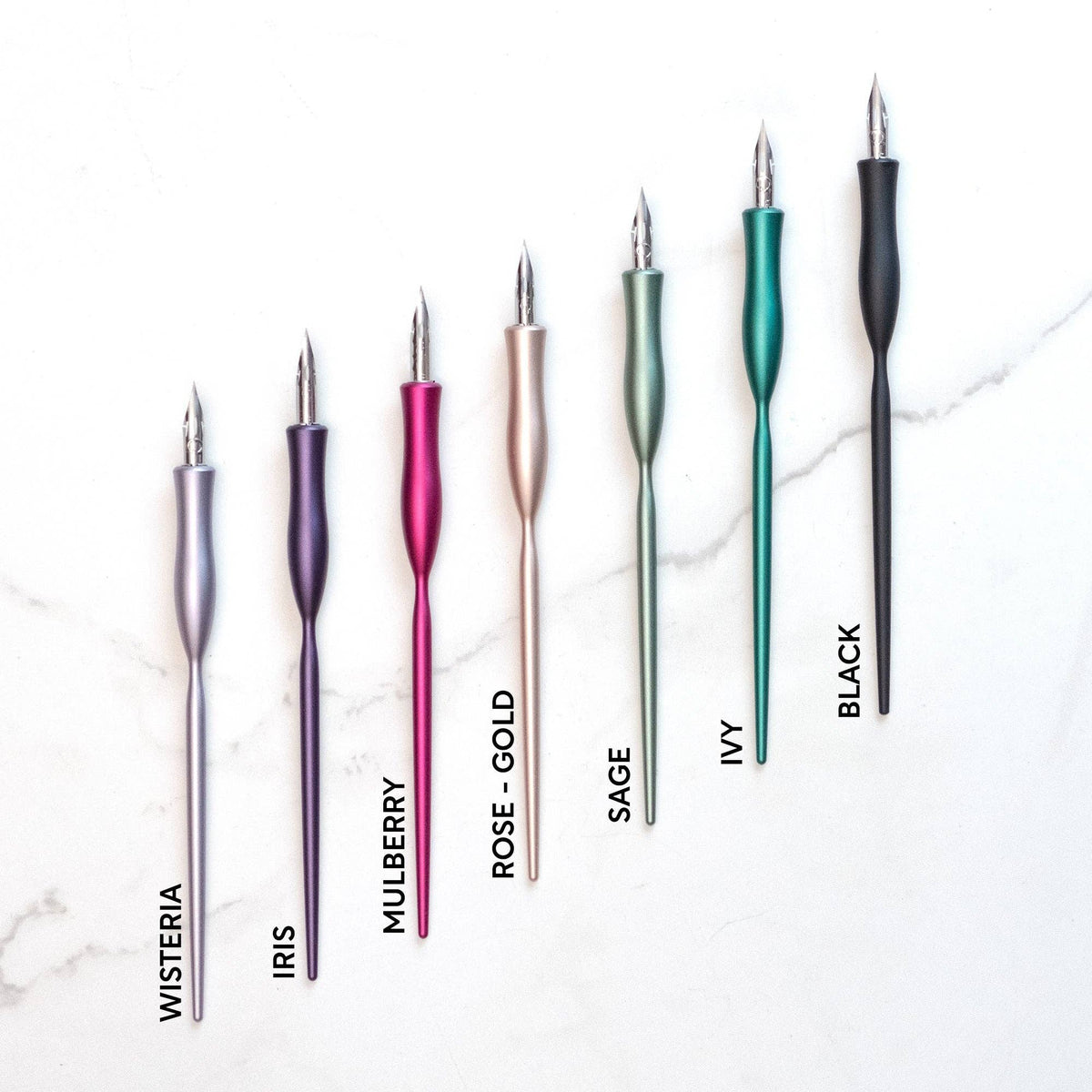 Flourish calligraphy pen set in assorted colors with gold nibs, including black