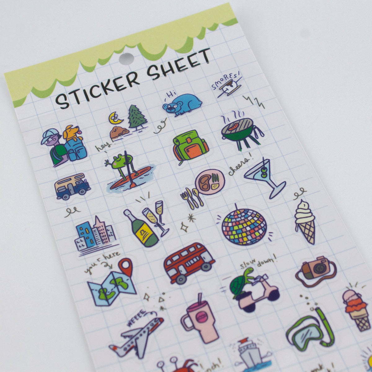 Clear planner sticker sheet with grid background and travel-themed sticker icons