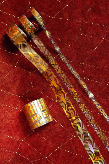 Gold art deco transparent tape rolls with metallic geometric pattern ribbons