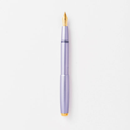 Lilac fountain pen with gold nib and clip, shown upright.