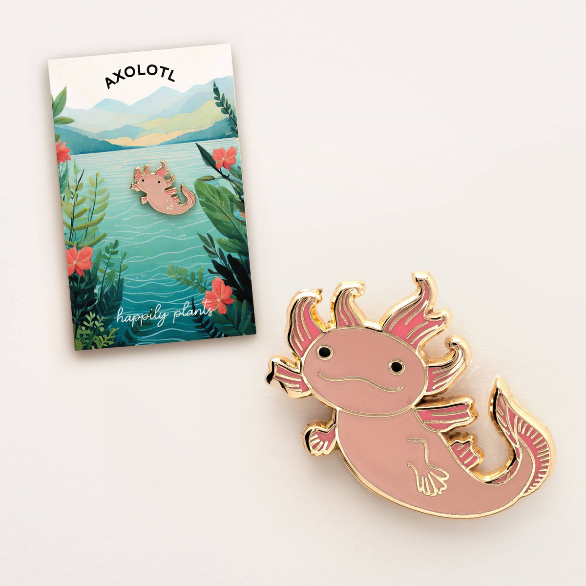 Pink axolotl enamel lapel pin with gold edging and detailed fins