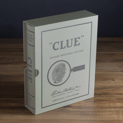 Vintage game box with CLUE logo and fingerprint-and-key emblem on white cover