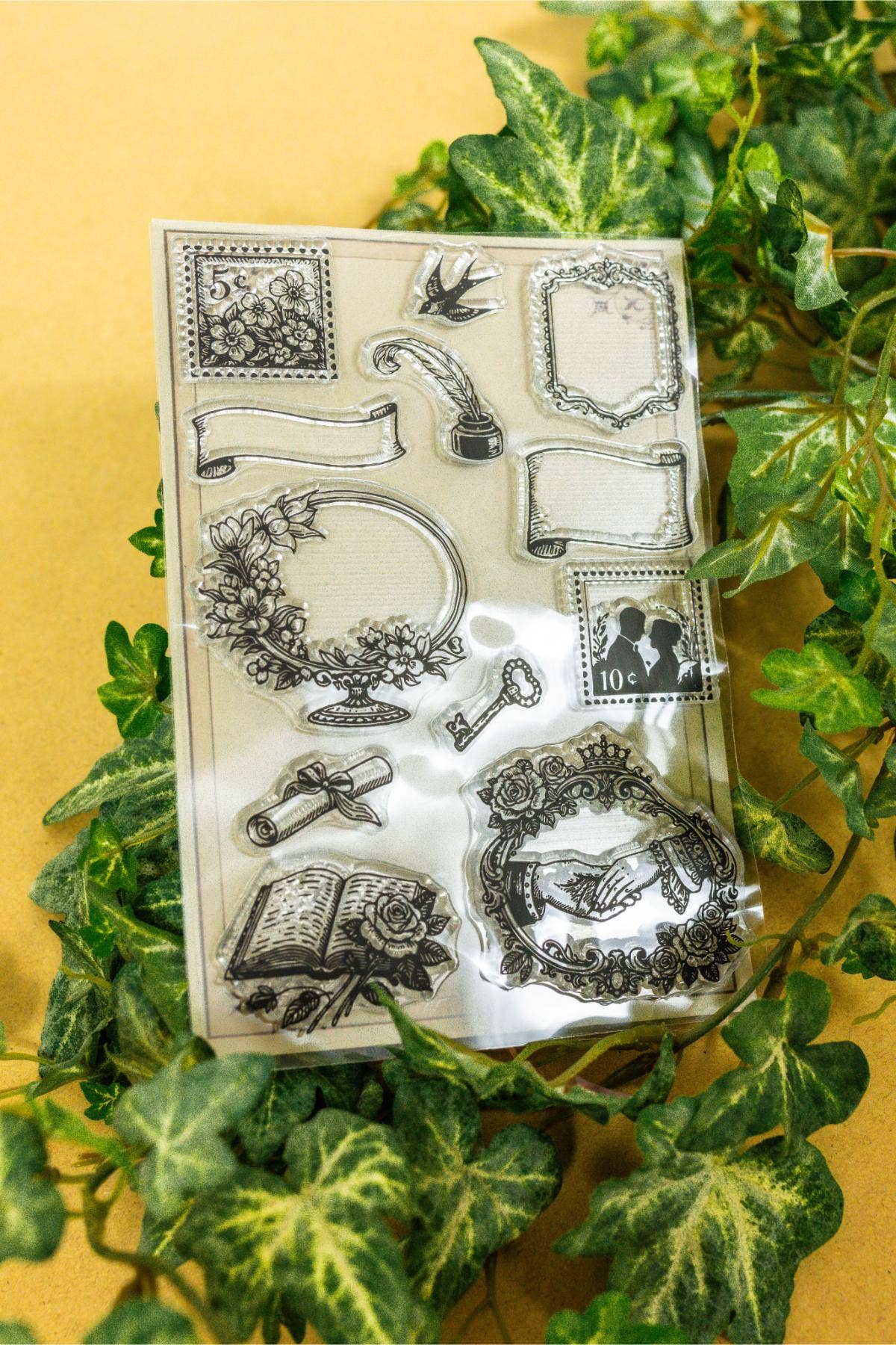 Clear stamp sheet with detailed floral borders, lamp motifs, and decorative squares