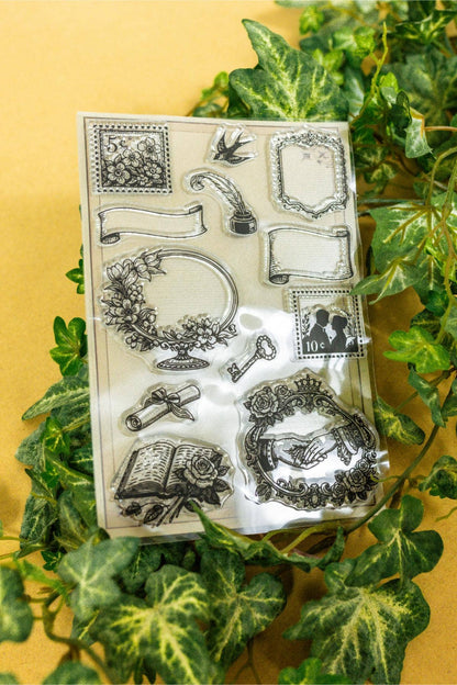 Clear stamp sheet with detailed floral borders, lamp motifs, and decorative squares
