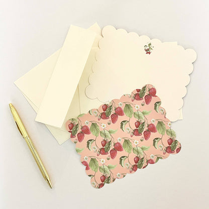 Scalloped note card with strawberry floral print and two cream envelopes