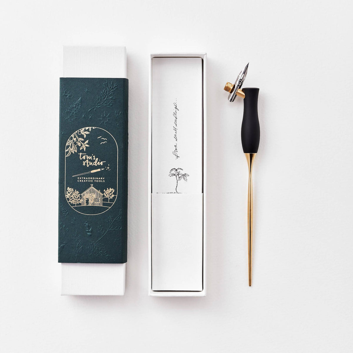 Calligraphy pen with oblique nib, black handle, shown with gift box
