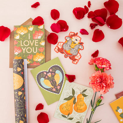 Bird and heart greeting card shown with other floral cards and paper goods