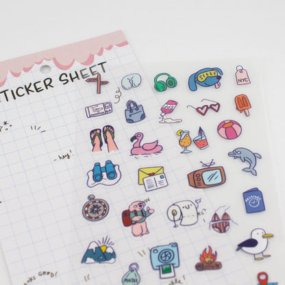 Close-up clear sticker sheet with colorful travel icons like shoes, seal, and postcards