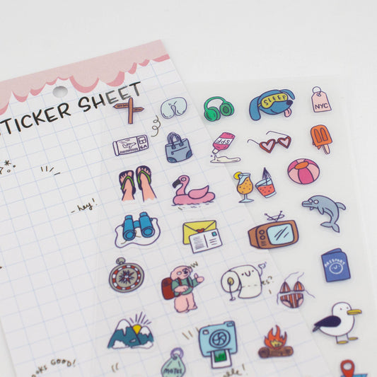 Close-up clear sticker sheet with colorful travel icons like shoes, seal, and postcards