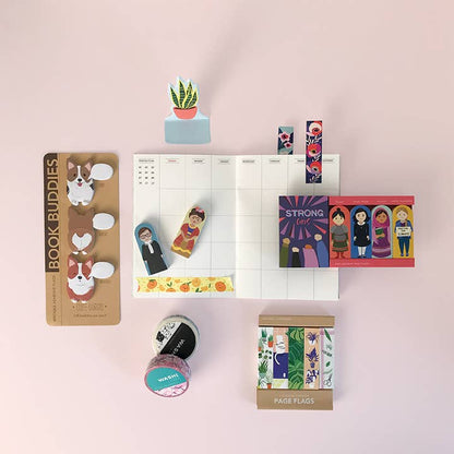 Floral washi tape rolls with page flags on a desk