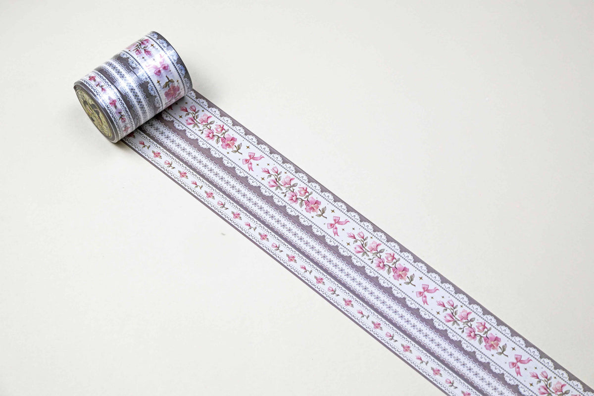 Washi tape roll with lilac stripe, pink flowers, and lace edging