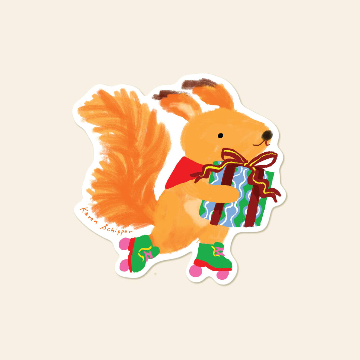 Vinyl squirrel sticker wearing a red cape and holding a colorful wrapped gift