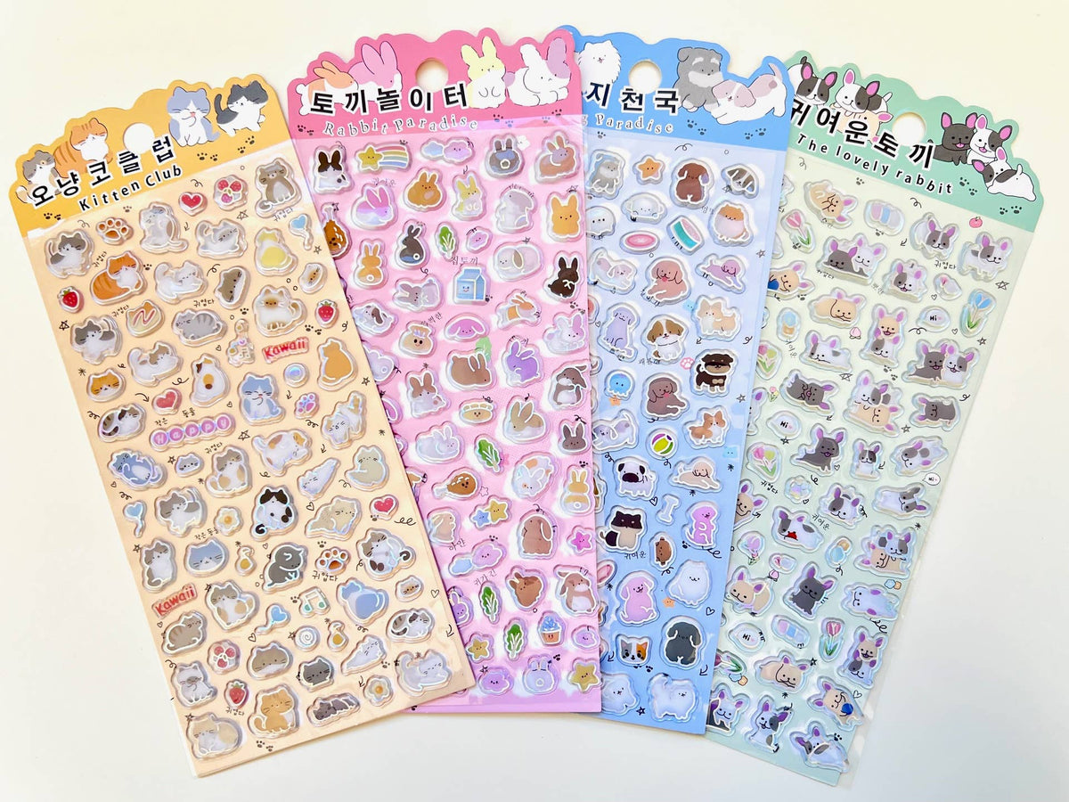 Set of four cute animal sticker sheets featuring dog and rabbit character designs