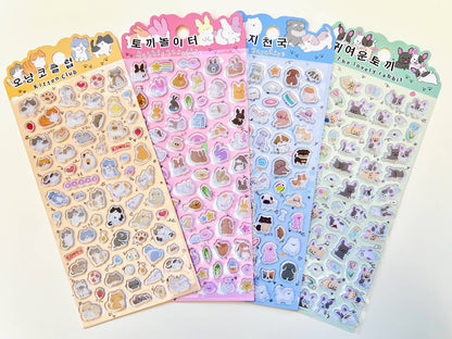 Set of four cute animal sticker sheets featuring dog and rabbit character designs