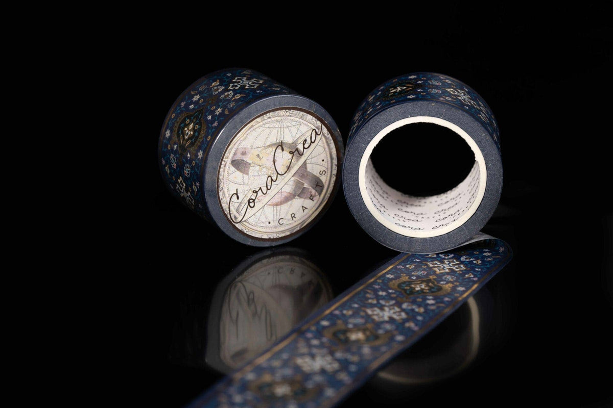 Blue foil washi tape roll pair with gold ornate pattern and visible inner core