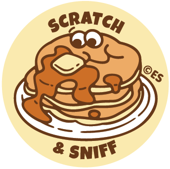 Circular scratch-and-sniff sticker with a pancake illustration and 'Scratch & Sniff' text