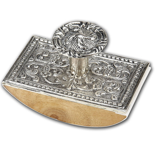 Silver ornate metal ink blotter with carved detailing and round finial, wood base