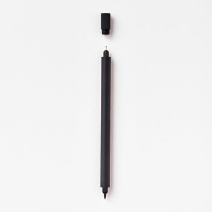 Matte black refillable multi-tip pen, capped, with visible writing tip