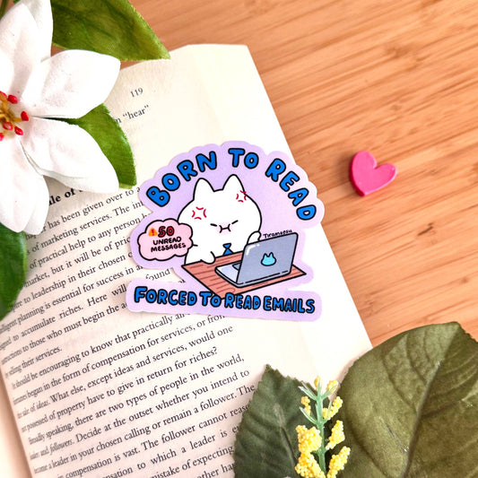 Open book page with cartoon text graphic: Born to Read, Forced to Read Emails