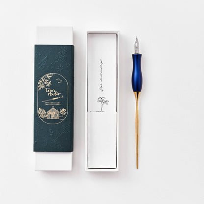 Blue calligraphy pen with oblique nib and gold accents, shown with gift box and sleeve