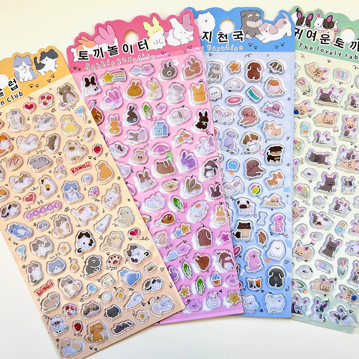 Kawaii sticker sheets with cartoon cats and animals, heart and accessory icons, shiny outlines.