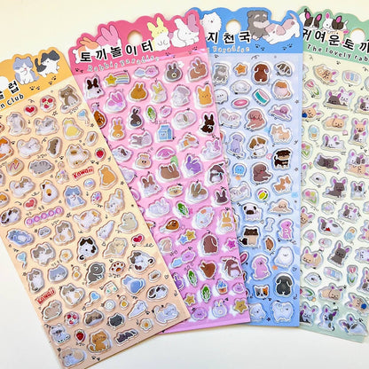 Kawaii sticker sheets with cartoon cats and animals, heart and accessory icons, shiny outlines.