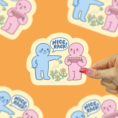 Vinyl sticker with two cartoon characters and “Nice Rack” text, held by a hand